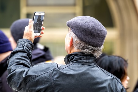 Munich / Germany - February 15 2018 : Man photographing the townhall with smartphoneのeditorial素材