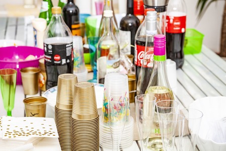 Essen / Germany - March 25 2018 : The party table is filled with bottles and cupsのeditorial素材