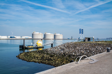 Rotterdam / Netherlands - April 19 2018 : The fast ferry pier is close to the oil tanks in the harbourのeditorial素材
