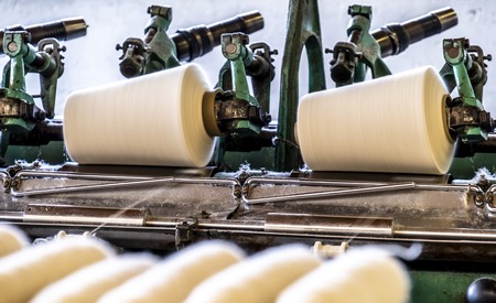 Cop winder of historic woolen mill production in Wales - United Kingdom.