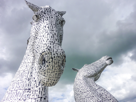 Falkirk / Scotland - June 22 2018 - Thunder clouds moving above The Kelpies statue by Andy Scot, Helix parkのeditorial素材
