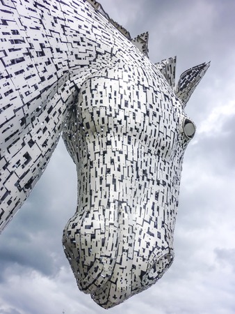 Falkirk / Scotland - June 22 2018 - Thunder clouds moving above The Kelpies statue by Andy Scot, Helix parkのeditorial素材
