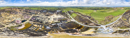 The colourful remains of the former copper mine Parys Mountain near Amlwch on the Isle of Anglesey, Wales, UKの写真素材