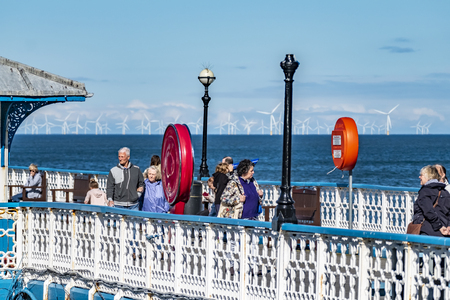 Llandudno / Wales - April 23 2018 : Folks enjoying the Pier at the seaside resort of Llandudno, North Wales, United Kingdomのeditorial素材