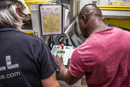 Burbach / Germany - July 16 2018 : African man showing how to use the automated warehosue