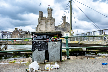Caernarfon / Wales - May 01 2018 : Dustbins overflowing close to the castleのeditorial素材