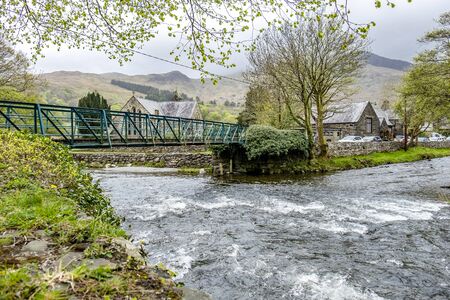 Glaslyn river running through Beddgelert in the heart of Smowdonia National Park in Gwynedd, Wales, UKの写真素材