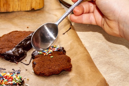 Preparing cookies with hot brown delicious molten chocolate and coarse sugar
