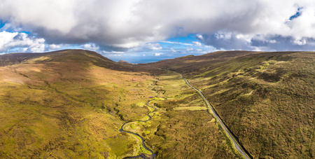 Aerial view of the mountain pass road on the top of Quiraing from Uig to Staffin - Isle of Skye, Scotlandの写真素材
