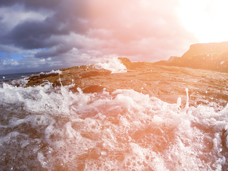 Blue Ocean Wave Crashing the coast at Sunrise