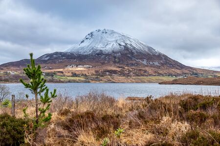 Mount Errigal by Dunlewey in County Donegal, Ireland, covered with snow.