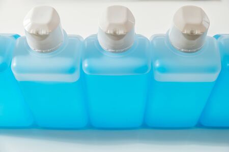 Collecting of desinfection liquide at home during pandemiaの写真素材