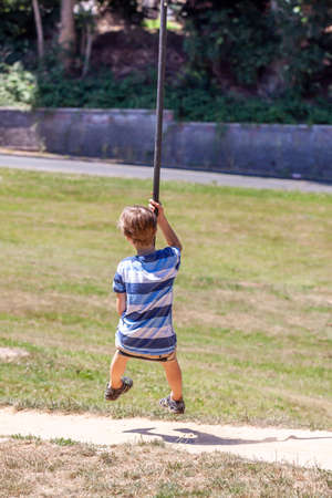 Happy kid on zip line in the city of Essen - Germanyの写真素材