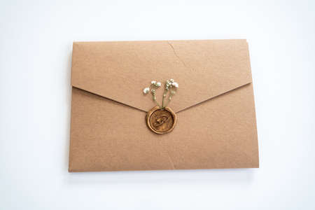 Envelope with wax seal and little dry flowers