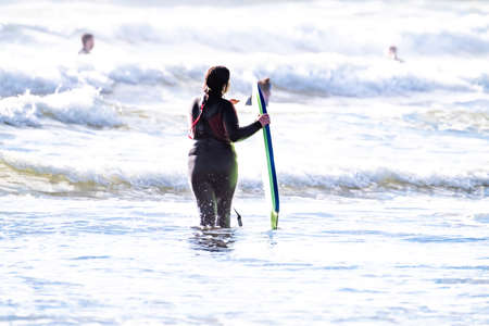 Rossnowlagh beach / Ireland - August 22 2020 : Folks enjoying the waves at the beach