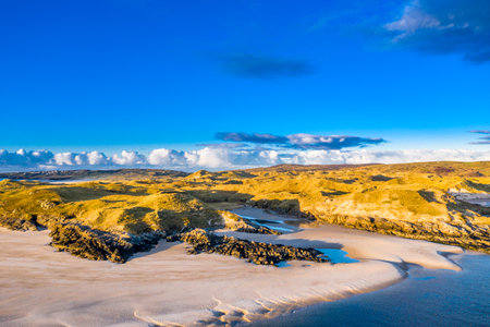 The coast between Kiltoorish bay beach and the Sheskinmore bay between Ardara and Portnoo in Donegal - Irelandの写真素材