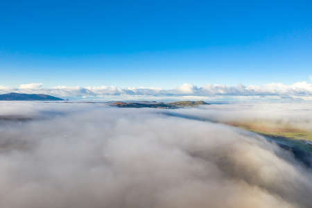 Above the clouds at Portnoo in County Donegal with fog - Irelandの写真素材