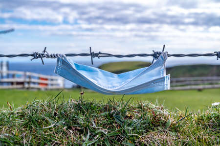 Mask in Fence at the Silver Strand in County Donegal - Irelandの写真素材