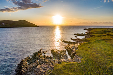 Sunset seen from Inishkeel Island by Portnoo harbour in County Donegal, Irelandの写真素材