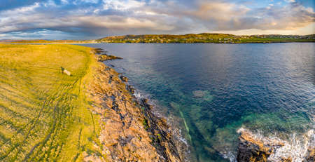 Aerial view of Portnoo harbour and Inishkeel Island in County Donegal, Ireland