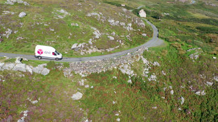 Donegal, Ireland - September 07 2021 : DPD van driving on the coastal roadのeditorial素材