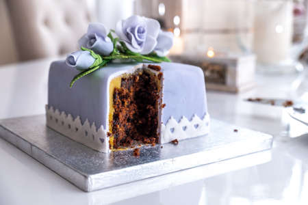 Beautiful decorated fruit cake with blue rosesの写真素材