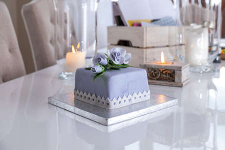 Beautiful decorated fruit cake with blue roses