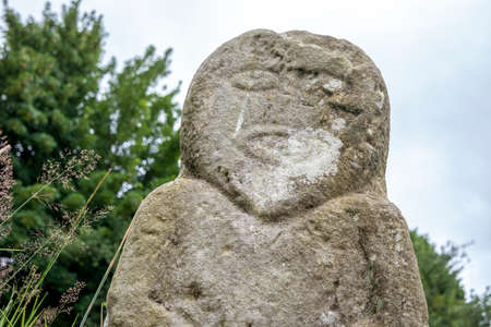 This is a bronze age stone carviing with two faces,called Janus, located In Caldragh Cemetery on Boa Island, Lower Lough Erne. Northern Irelandの写真素材
