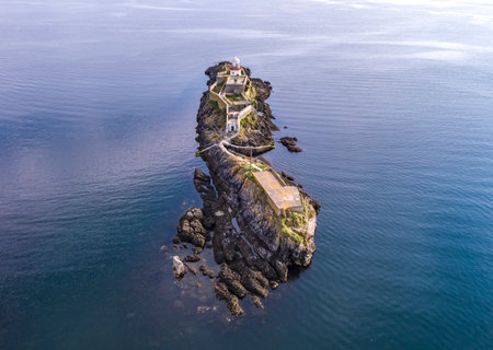 Aerial of the Rotten Island Lighthouse with Killybegs in background - County Donegal - Irelandの写真素材