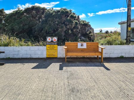 Burtonport, County Donegal, Ireland - August 23 2022 : The old railway track is converted into a walk with a restored bogie and benchのeditorial素材