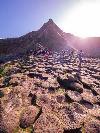 Giants Causeway, Northern Ireland, UK - November 05 2022 : People enjoying the 40000 interlocking...