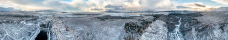Aerial view of snow covered Bonny Glen Woods by Portnoo in County Donegal, Ireland.