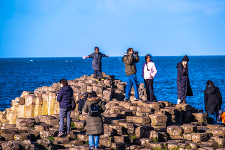 Giants Causeway, Northern Ireland, UK - November 05 2022 : People enjoying the 40000 interlocking basalt columnsのeditorial素材