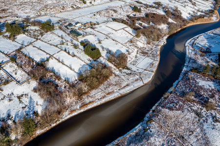 Aerial view of snow covered Gweebarra River between Doochary and Lettermacaward in Donegal - Irelandの写真素材