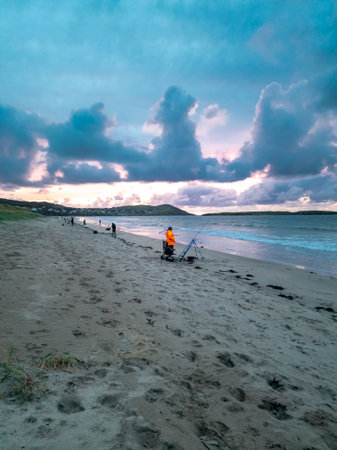Fishing at Narin, Portnoo strand during amazing sunset in County Donegal - Irelandの写真素材