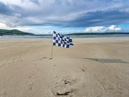 Checked white and flag racing flag on Narin strand by Portnoo, County Donegal, Irelandの写真素材