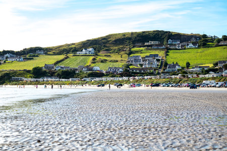 Downings, Ireland - July 31 2022: Holiday makers enjoying the beach