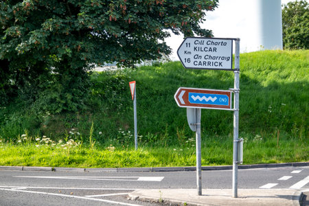 Killybegs, Ireland - May 16 2023: The sign at the roundabout is showing the way to Kilcar and Carrickのeditorial素材