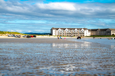 Downings, Ireland - July 31 2022: Holiday makers enjoying the beachのeditorial素材