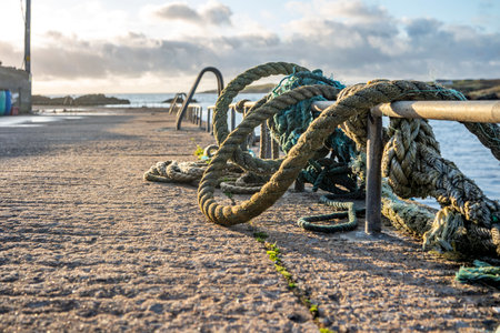 Ropes and ladder into the sea at coastal harbour