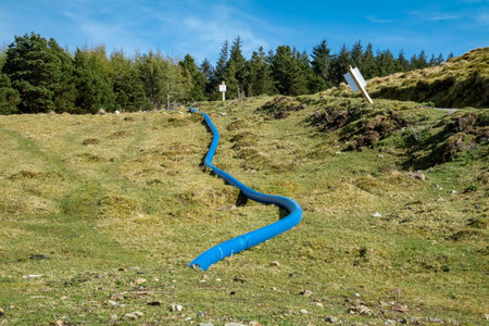 The blue water supply pipe coming from of Lough Anna, the drinking water supply for Glenties and Ardara - County Donegal, Irelandの写真素材