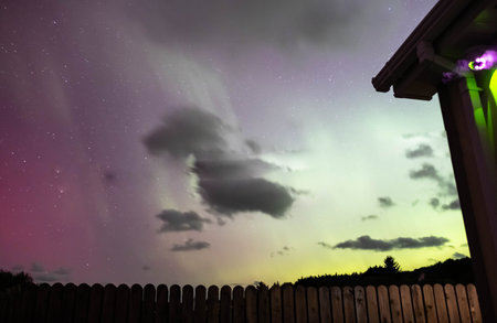 The Aurora Borealis, the northern lights, showing up above bungalow in County Donegal, Irelandの写真素材