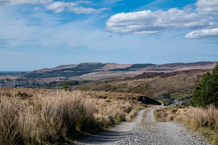 The blue water supply pipe coming from of Lough Anna, the drinking water supply for Glenties and Ardara - County Donegal, Ireland - Carnaween in the backgroundの写真素材