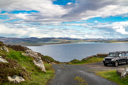 The coastal single track road between Meenacross and Crohy Head south of Dungloe, County Donegal - Irelandの写真素材