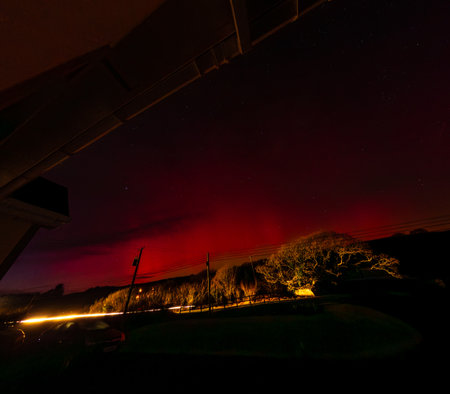 The Aurora Borealis, the northern lights, seen from bungalow in County Donegal, Irelandの写真素材
