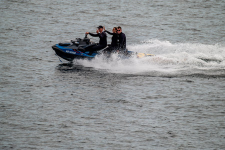 Dunkineely, Ireland - August 15 2025 : Jetski drivers passing bye and giving the finger
