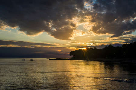 Beautiful sunset above the sea in Umag, Istria in Croatia, Europe.の写真素材