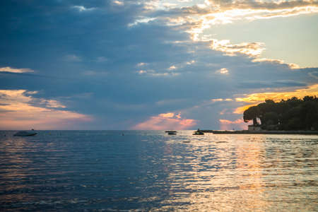Beautiful sunset above the sea in Umag, Istria in Croatia, Europe.の写真素材