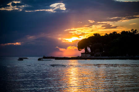 Beautiful sunset above the sea in Umag, Istria in Croatia, Europe.の写真素材