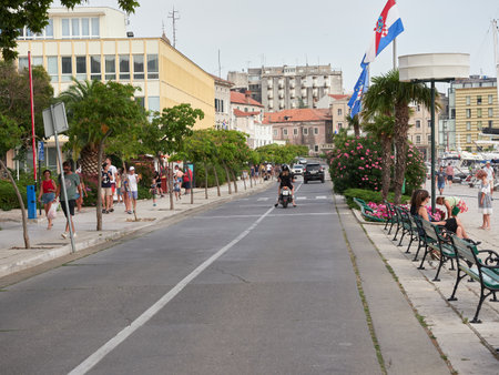 Å ibenik, Croatia - July 26, 2021: Main street at the seaside promenade in the old town in Sibenik.のeditorial素材